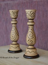 Pair of candlestick holders pyrographed with spirals